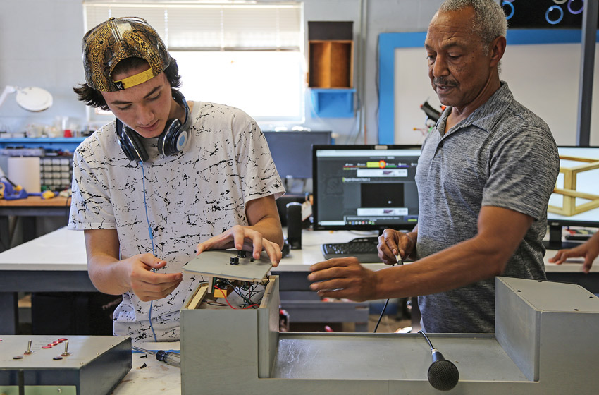 Picture of Daviean, 17, and his Boys Ranch mentor Barre Wheatley, technology coordinator