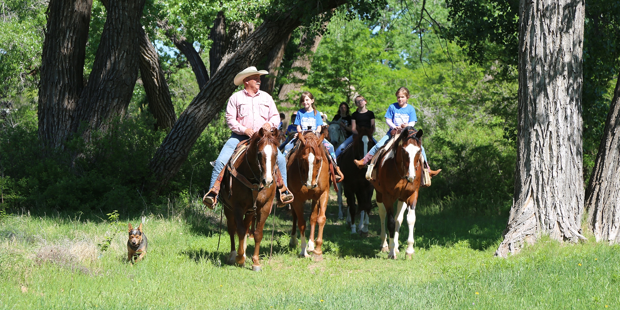 Staff and Youth Riding Horses